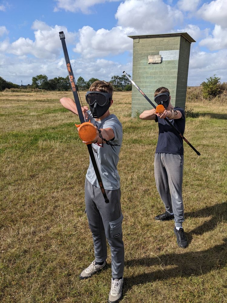 two teenage boys on a combat archery experience
