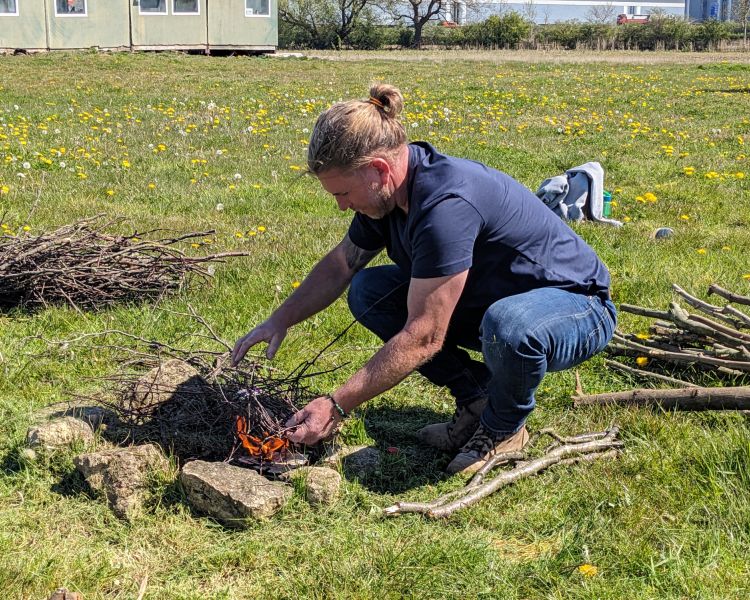lighting a fire on a bushcraft experience