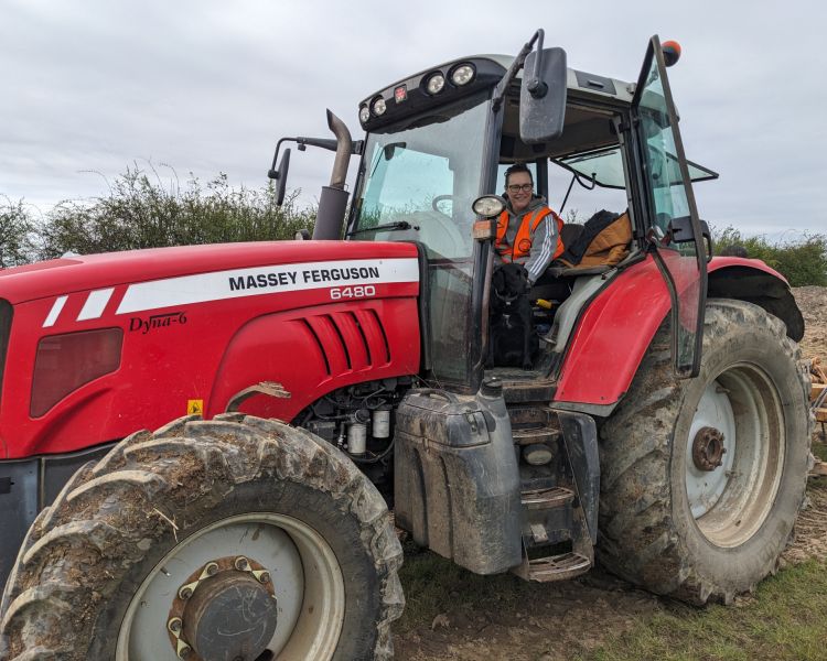 man sitting in tractor on a tractor driving experience