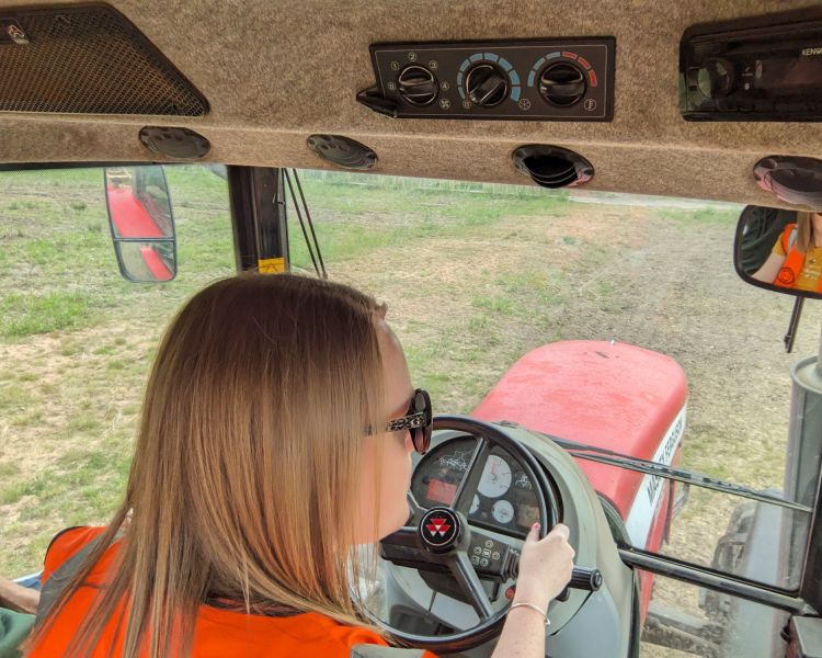 woman driving tractor on tractor driving experience