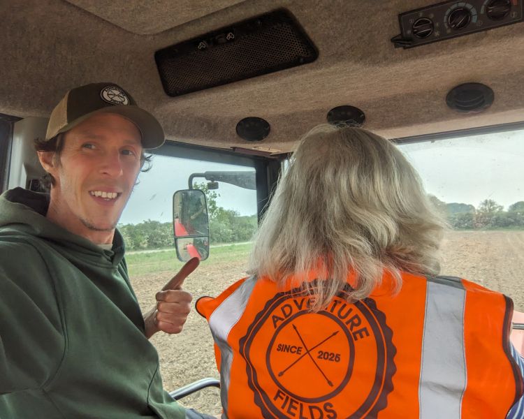 man sitting in tractor on tractor driving experience