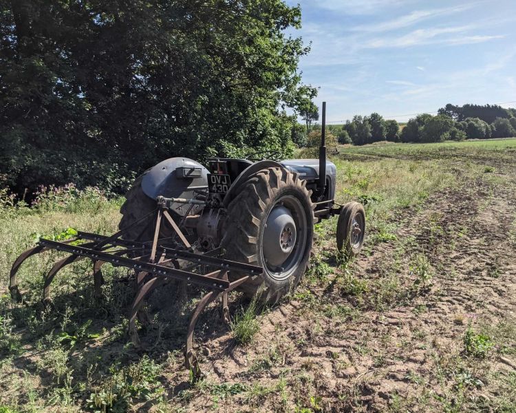 a vintage tractor in a field for a tractor driving experience