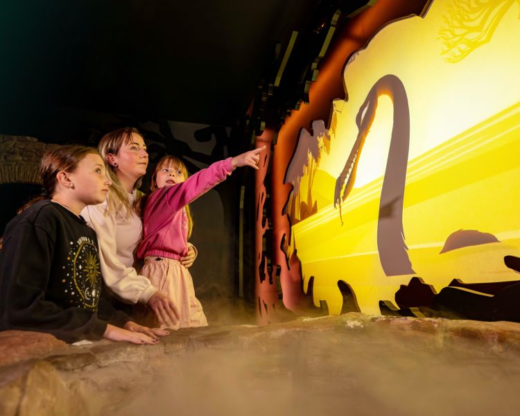 a family learning about the myth of nessie at the loch ness experience