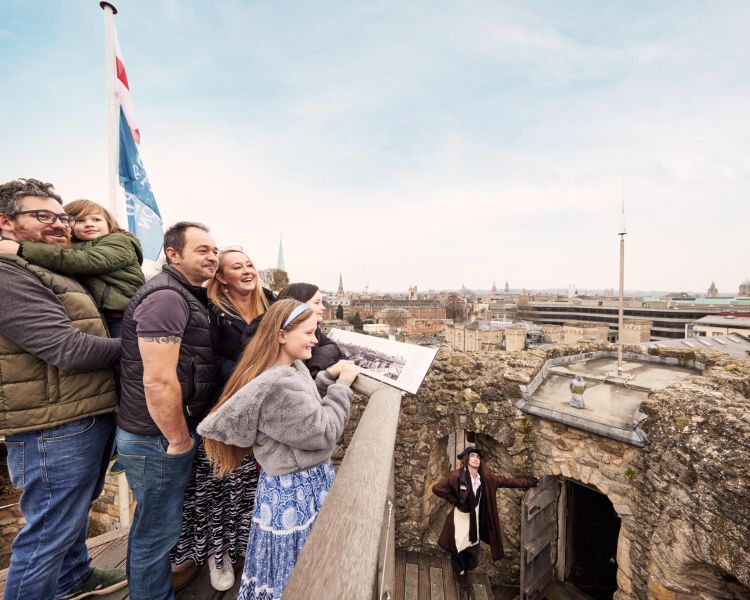 Guests overlooking Oxford from St Georges Tower at Oxford Castle & Prison