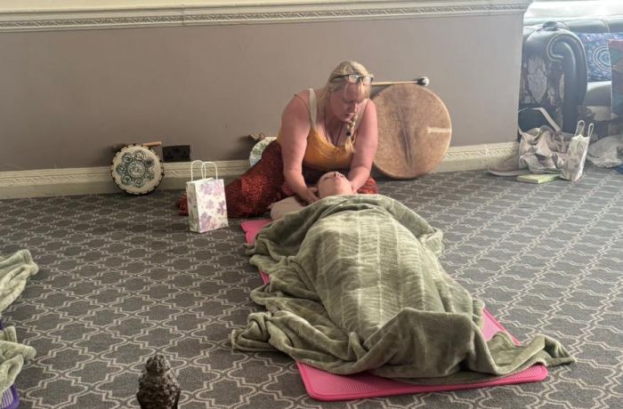 woman lying down having meditation on a wellness retreat day