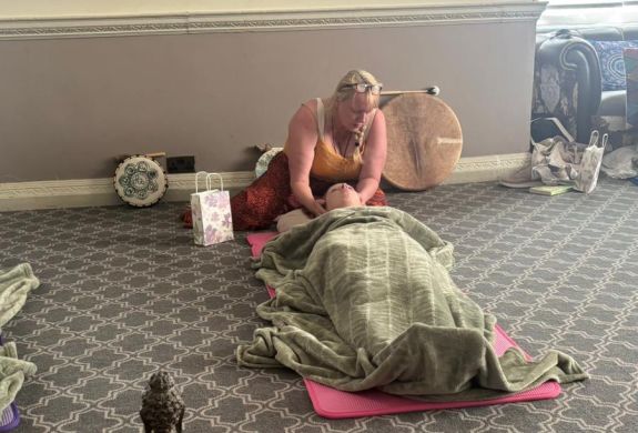 woman lying down having meditation on a wellness retreat day