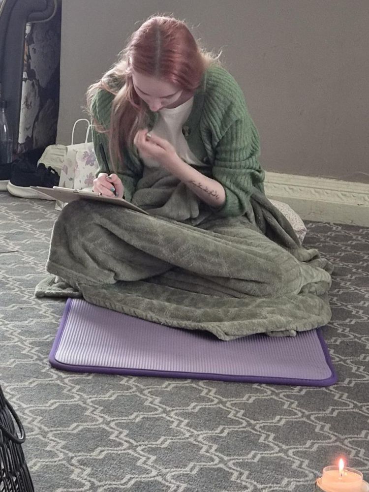 woman journaling on a wellness retreat day