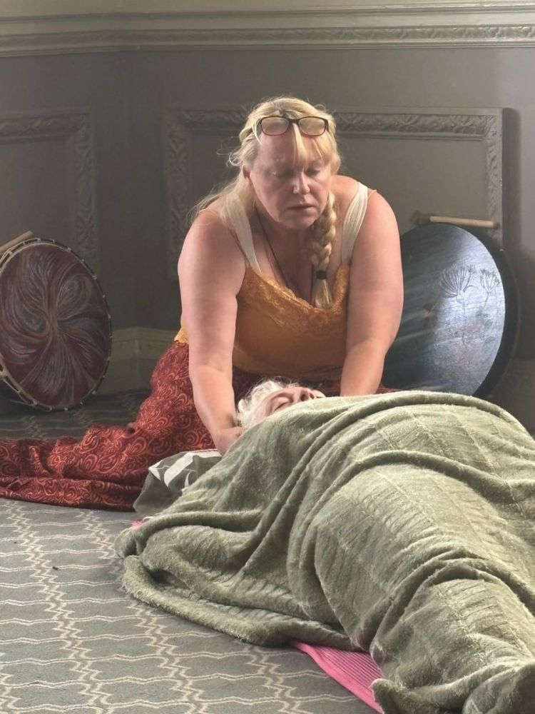woman lying down having meditation on a wellness retreat day