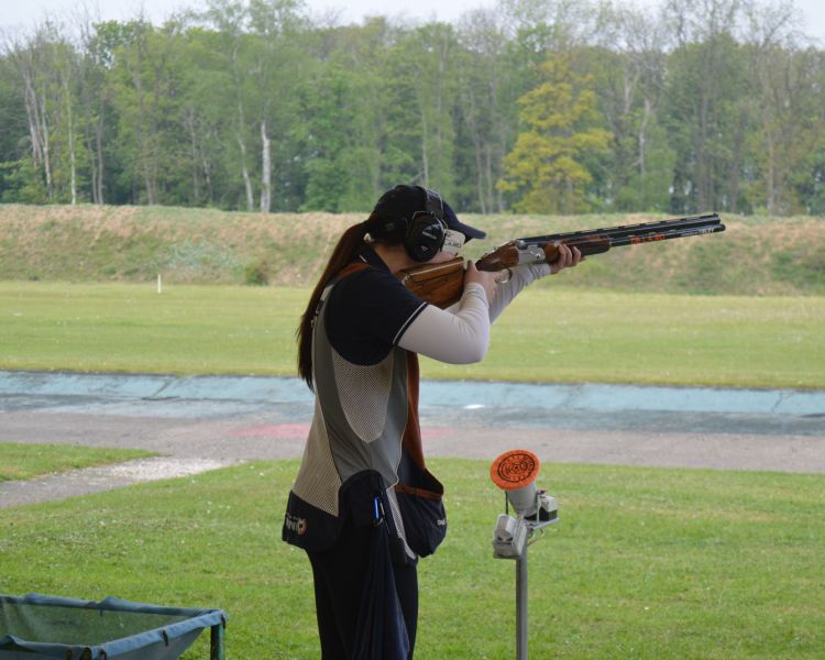 A woman clay pigeon shooting