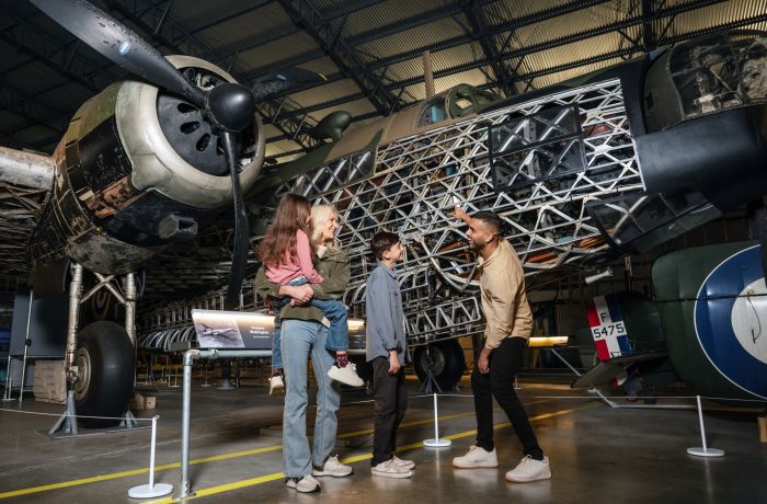 family visiting brooklands museum looking at planes