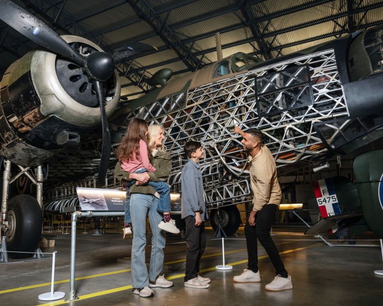 family visiting brooklands museum looking at planes