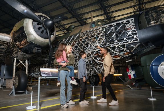 family visiting brooklands museum looking at planes