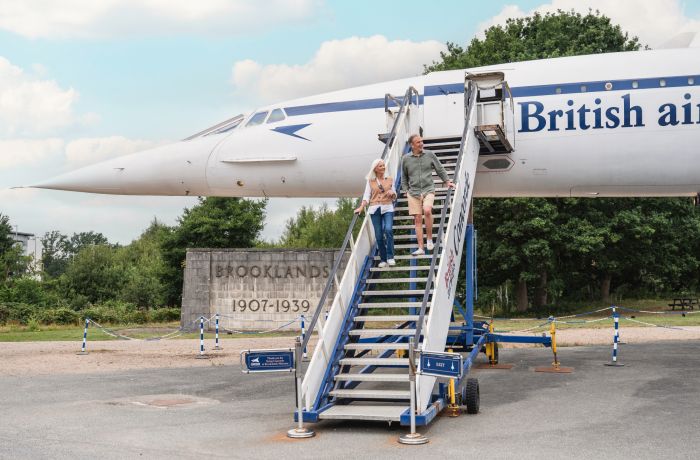 couple walking down the steps of concorde at brooklands museum