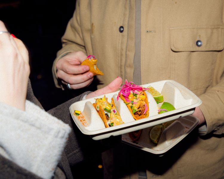 Couple eating tacos on food treasure hunt in manchester