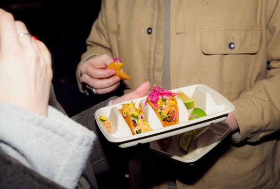 Couple eating tacos on food treasure hunt in manchester