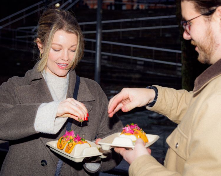 Squeezing lime on tacos on food treasure hunt in manchester