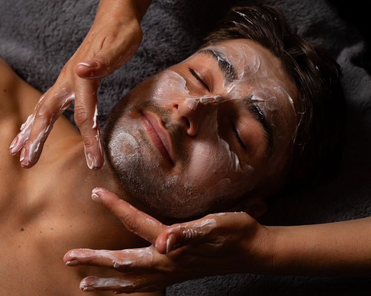 A man getting a facial spa treatment