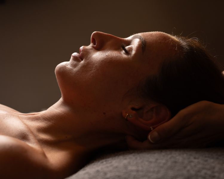 A woman getting a head massage
