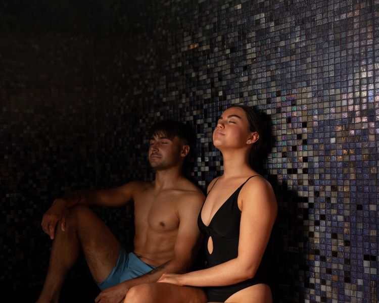 A man and woman in a sauna