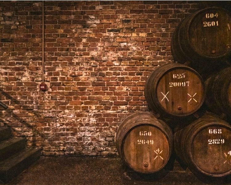 Whisky barrels stacked at whisky distillery