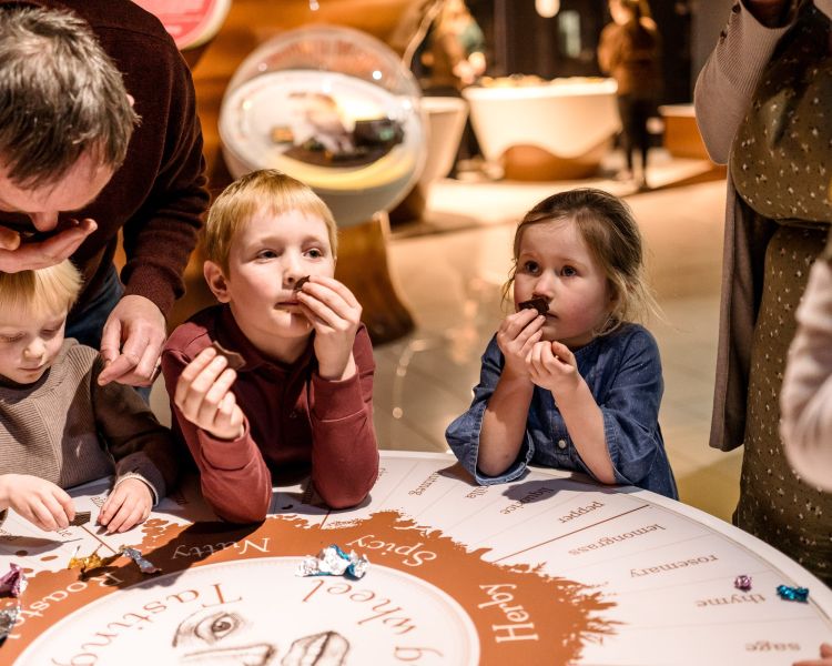 Children eating chocolate samples at york chocolate story