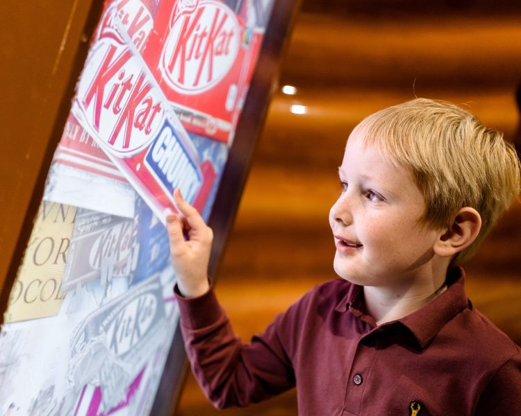 Young boy looking at display at york chocolate story