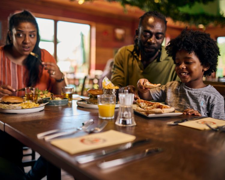 family eating in restaurant at legoland windsor