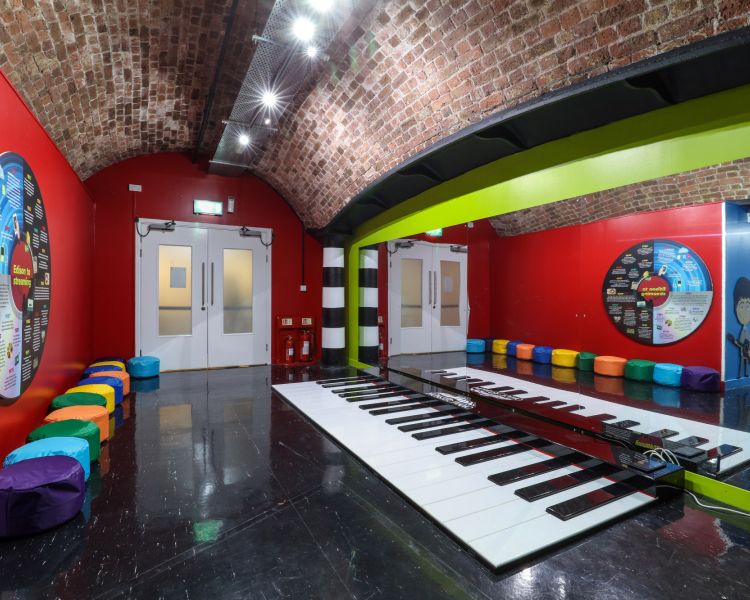 piano on the floor at the beatles story museum in liverpool