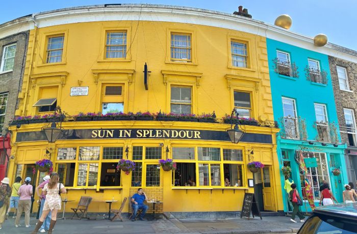 Bright yellow sun in splendor pub in notting hill