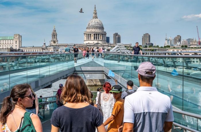 Walking across bridge towards st pauls cathedral