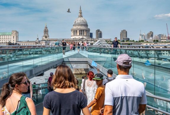 Walking across bridge towards st pauls cathedral