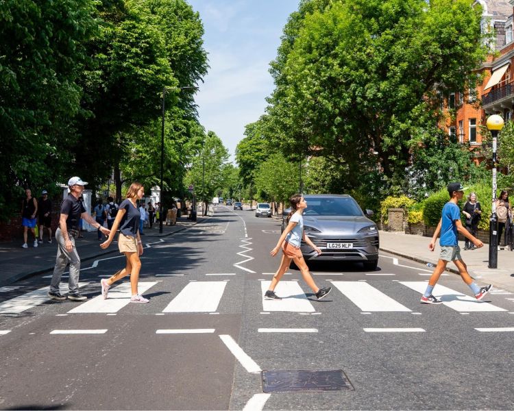 Walking the abbey road zebra crossing on beatles london tour