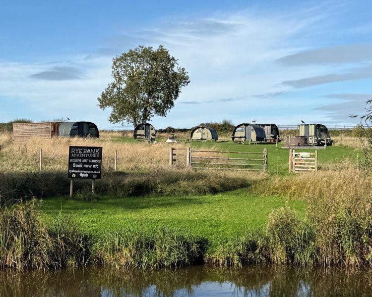 canal bank view of glamping site