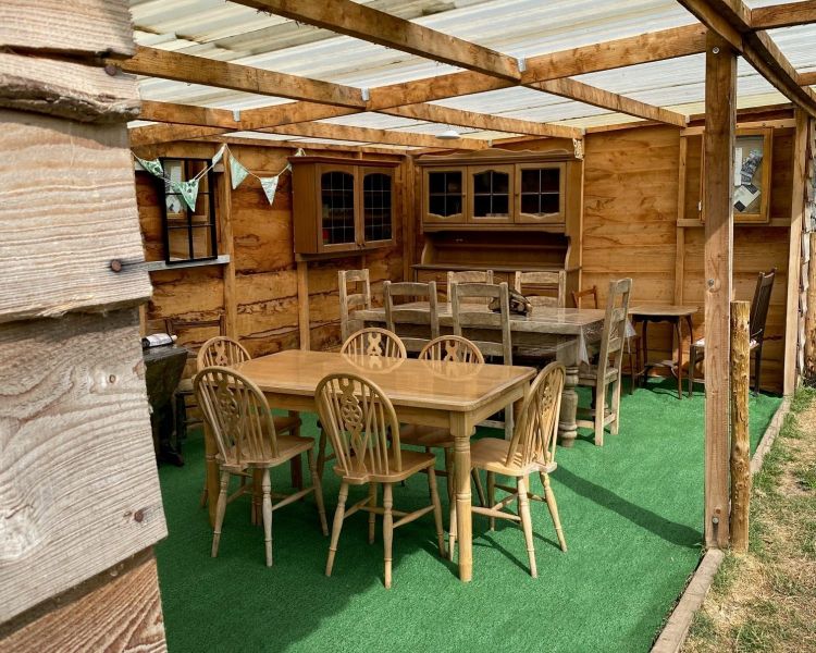 covered outdoor dining area on glamping site