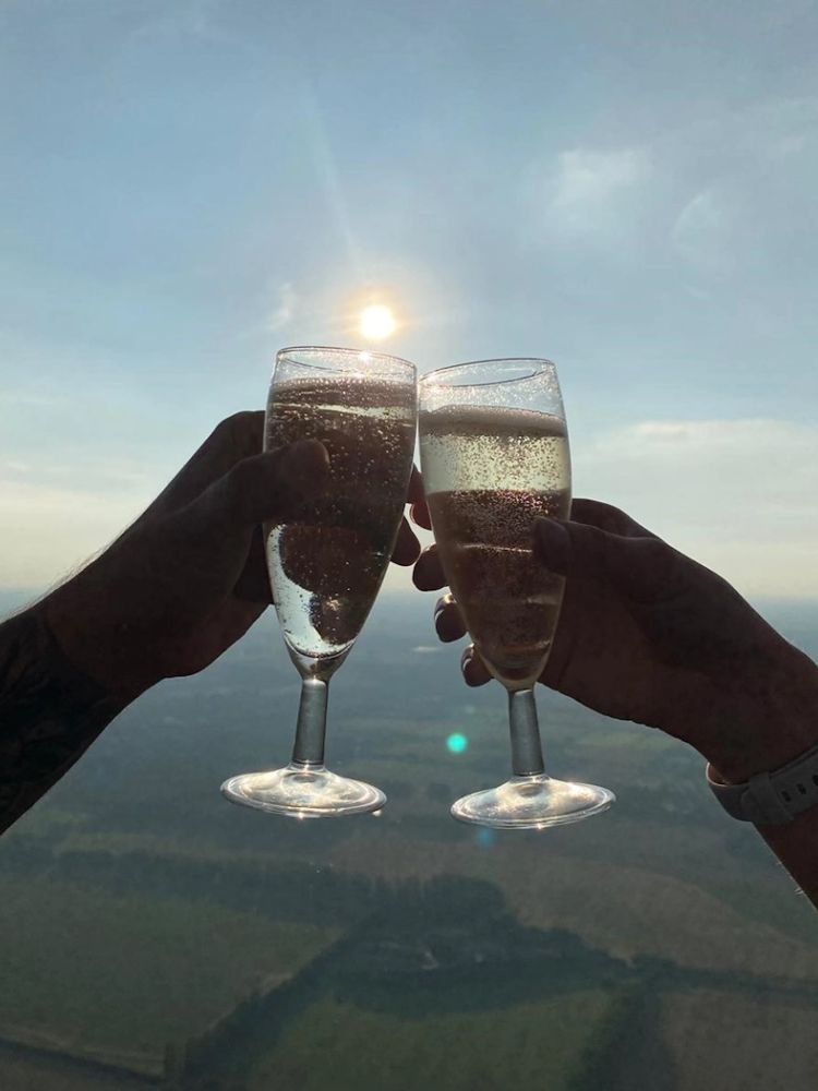 champagne glasses in sky on hot air balloon ride