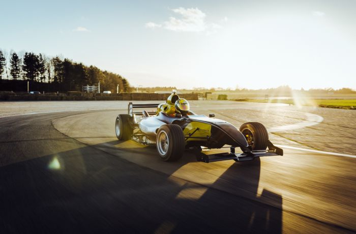 an f1000 on a race track at a gt race car driving experience