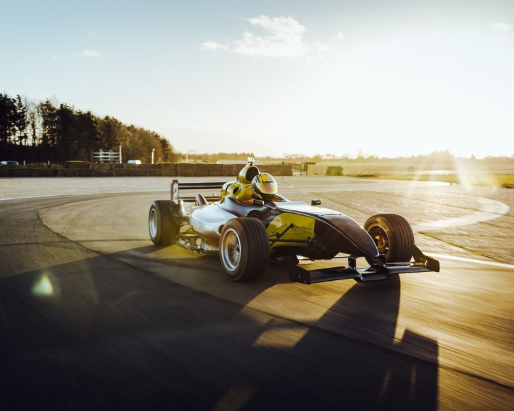 an f1000 on a race track at a gt race car driving experience