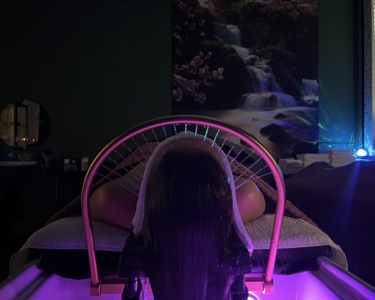 Woman on bed for japanese head spa treatment