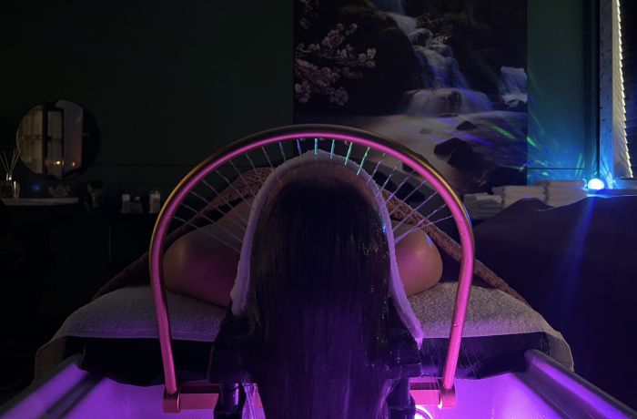 Woman on bed for japanese head spa treatment