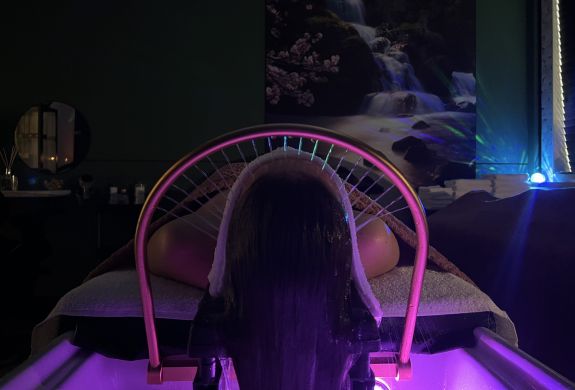 Woman on bed for japanese head spa treatment