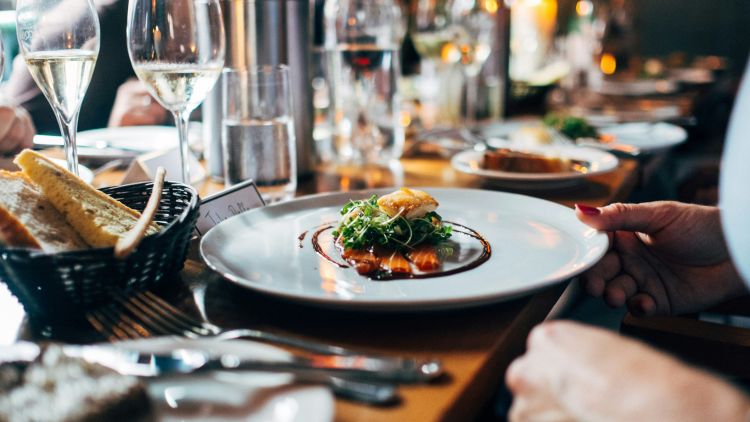 Stock image of meal with wine at restaurant