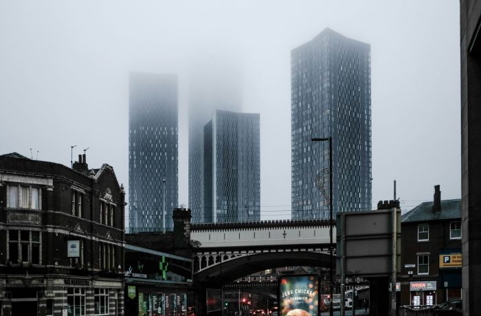city centre shot of skyscrapers on a grey and misty day