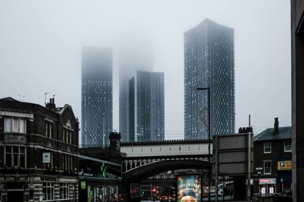 city centre shot of skyscrapers on a grey and misty day