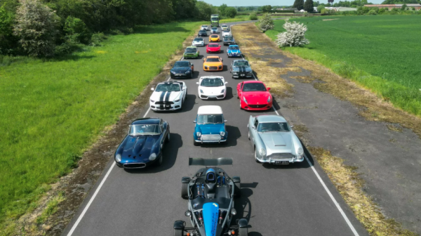 sports cars and classic cars lined up on a road to show things to do in Wigan like driving experience days