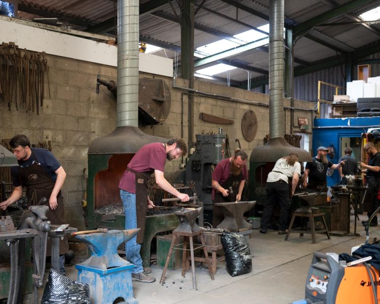 participants on a blacksmith experience in suffolk