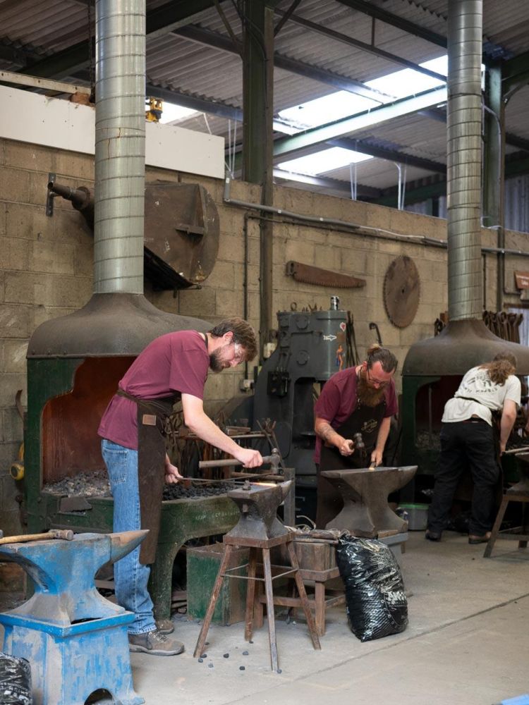 participants on a blacksmith experience in suffolk