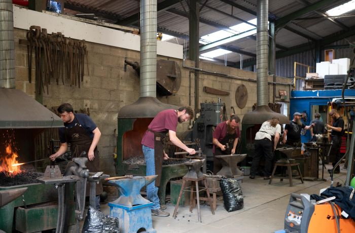 participants on a blacksmith experience in suffolk
