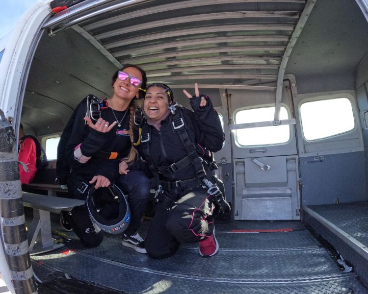 two skydivers in plane before jumping over devon