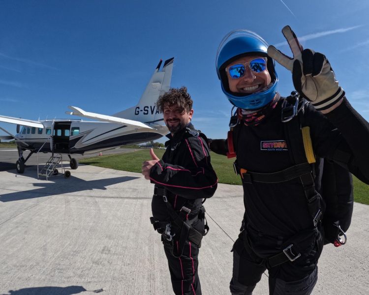 skydivers on airfield in front of plane in devon