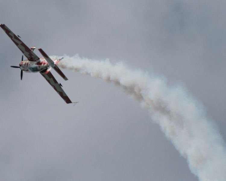 plane doing an aerobatic manoeuvre in the sky